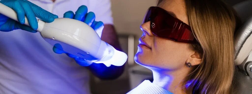 Patient receiving in-office LED teeth whitening treatment in Dover, NJ